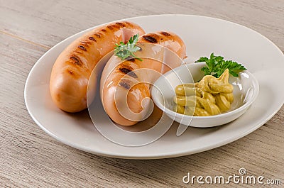 Grilled sausages with mustard sauce Stock Photo