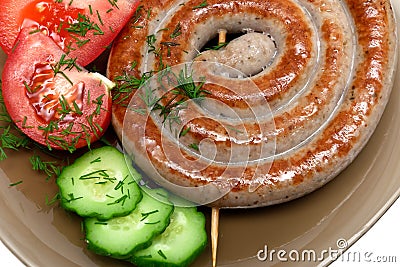 Grilled sausages with vegetables and dill close-up Stock Photo