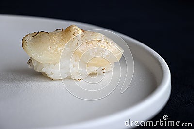 Grilled Scallop Sushi on white plate Stock Photo