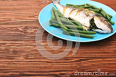 Grilled sea bream fish with green beans Stock Photo
