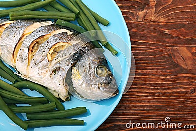 Grilled sea bream fish with green beans Stock Photo