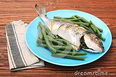 Grilled sea bream fish with green beans Stock Photo