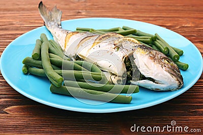 Grilled sea bream fish with green beans Stock Photo