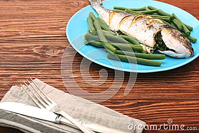 Grilled sea bream fish with green beans Stock Photo