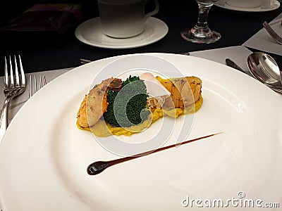 Grilled shrimp, broccoli, roll and scallop on sweet pumpkin mousse. Stock Photo