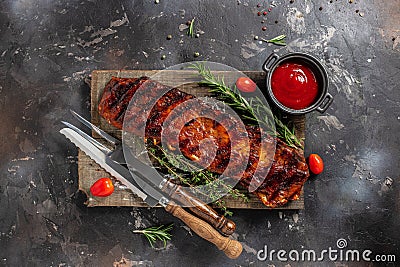 Grilled and smoked ribs with barbeque sauce. Delicious barbecued ribs. Food recipe background. Close up Stock Photo