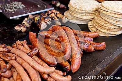 Grilled sousage, different tipe of meat and pita bread. Stock Photo