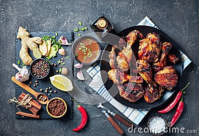 Grilled spicy Jerk Chicken drumsticks and thighs Stock Photo