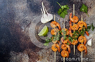 Grilled spicy lime shrimp skewers with creamy avocado garlic cilantro sauce. Top view, overhead, flat lay, copy space. Stock Photo