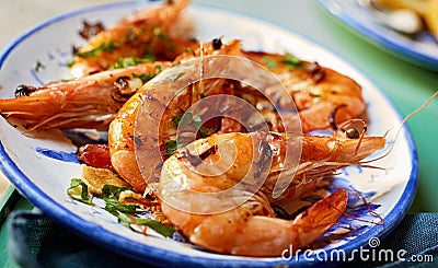 Grilled spicy pink prawns with fresh herbs Stock Photo