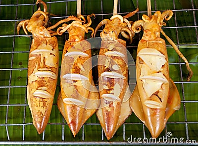 Grilled Squid, Thailand Food - Barbecue from squids sold on the Stock Photo