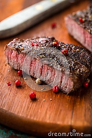 Grilled steak with peppercorns Stock Photo