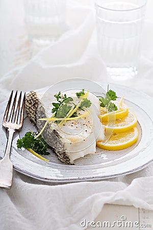 Grilled stripped bass with lemon and herbs Stock Photo