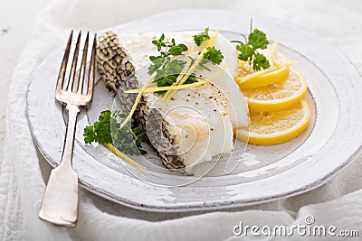 Grilled stripped bass with lemon and herbs Stock Photo