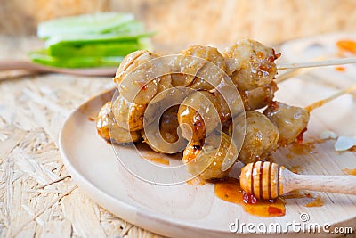 Grilled Thai meat ball with spicy sauce, selective focus Stock Photo