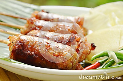 Grilled Thai sausage stuffed rice and pork eat with fresh vegetable on plate Stock Photo