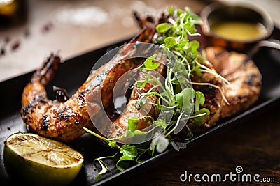 Grilled tiger prawns with chilli sauce and lime Stock Photo