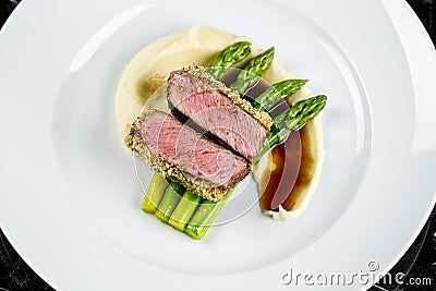 Grilled tuna with asparagus Stock Photo