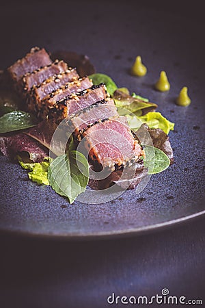 Grilled Tuna Steak with Salad and Wasabi Sauce Stock Photo