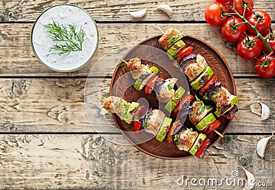 Grilled turkey or chicken meat shish kebab skewers with tzatziki Stock Photo