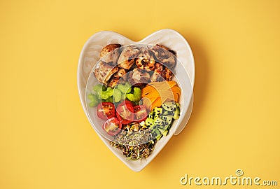 Grilled turkey fillet, avocado, fresh vegetables and sprouts with olive oil, top view. Buddha bowl Balanced healthy diet. Stock Photo