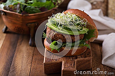 Grilled vegan bean burger with greens Stock Photo