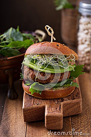 Grilled vegan bean burger with greens Stock Photo