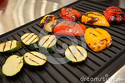 Grilled vegetables on baking sheet, red pepper and yellow pepper, zucchini Stock Photo