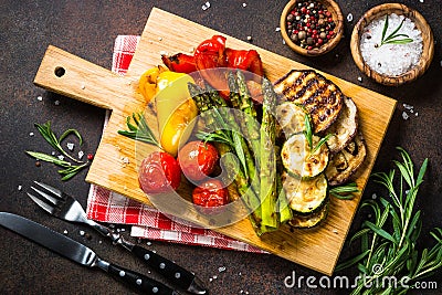 Grilled vegetables - zucchini, paprika, eggplant, asparagus and tomatoes. Stock Photo
