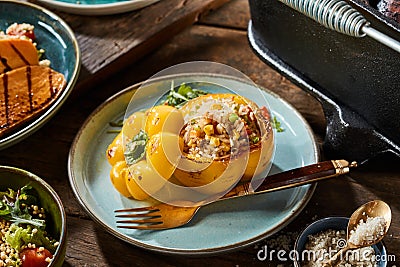 Grilled whole sweet pepper with couscous stuffing Stock Photo