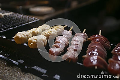 Grilled yakitori chicken skewers at an Izakaya restaurant in Omoide Yokocho street in the Shinjuku district of Tokyo.. Stock Photo