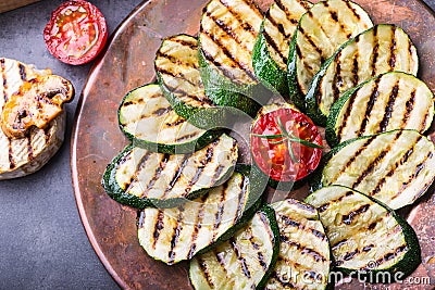 Grilled Zucchini Tomato with chili pepper. Italian mediterranean or greek cuisine. Vegan vegetarian food Stock Photo