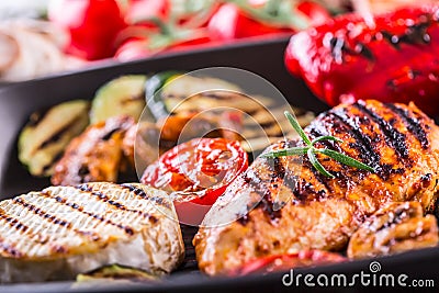 Grilled Zucchini Tomato with chili pepper. Italian mediterranean or greek cuisine. Vegan vegetarian food Stock Photo