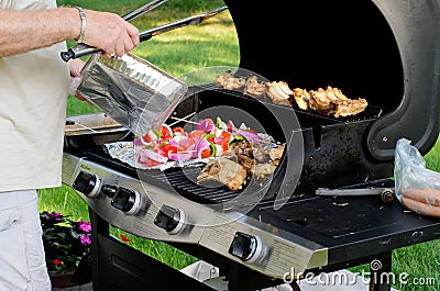 Grilling in the back yard. Stock Photo