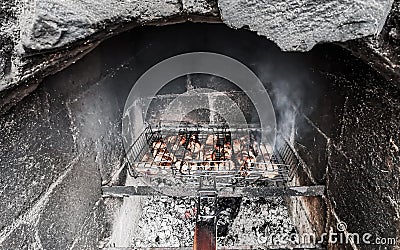 Grilling marinated chiken shashlik on a grill Stock Photo