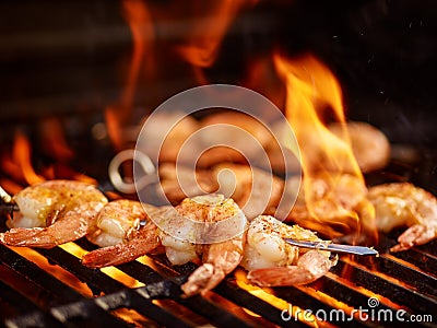 Grilling shrimp on skewer on grill Stock Photo