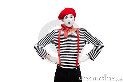 grimacing mime standing with hands akimbo Stock Photo