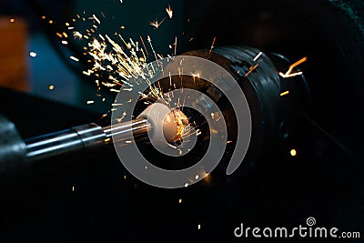 Grinding the exit hole with an abrasive stone on a circular grinder Stock Photo