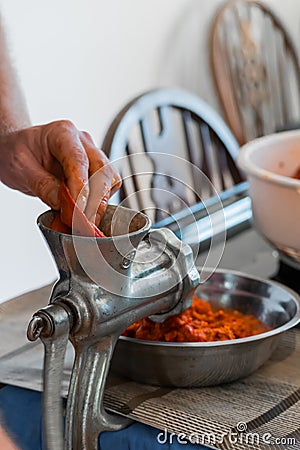 Grinding paprika for Ajvar Stock Photo