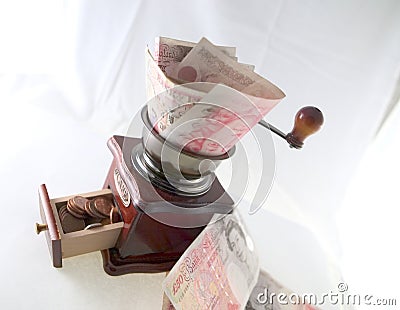 Grinding pounds into pennies Stock Photo