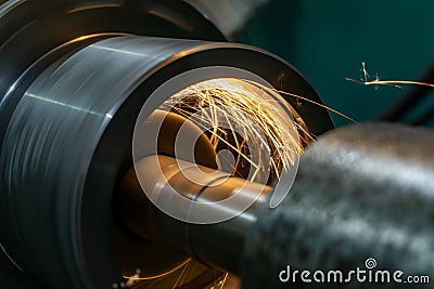 Grinding work of the workpiece on a cylindrical grinding machine Stock Photo