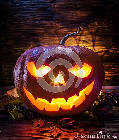 Grinning pumpkin latern or jack-o`-lantern is one of the symbols of Halloween. Halloween attribute Stock Photo