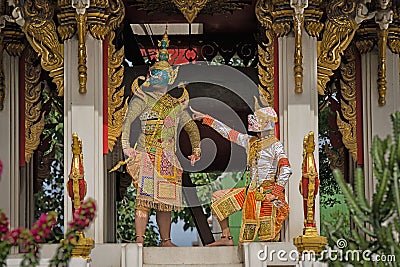 a gripping Khon drama scene from the Ramayana, featuring an intense battle between Ravana and Hanuman. Their vibrant masks and Stock Photo