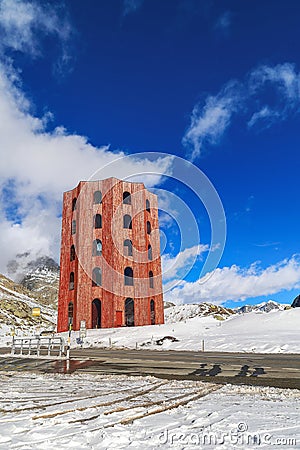 The red Julier Theater Tower on the Julier Pass (2284 m above sea level) in winter. Stock Photo