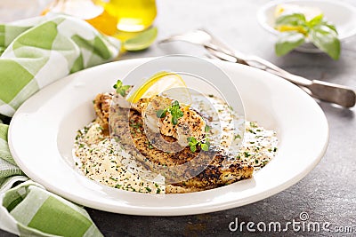 Grits with fried fish and shrimp Stock Photo