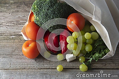 Groceries in eco bag. Eco natural bag with fruits and vegetables. Zero waste food shopping. Plastic free items. reuse, reduce, Stock Photo