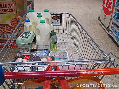 Groceries in a Sainsbury's shopping trolley or cart. Editorial Stock Photo