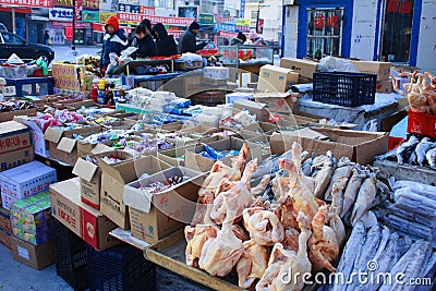 Grocery market, people selling ice cream and frozen food outside in cold winter Editorial Stock Photo