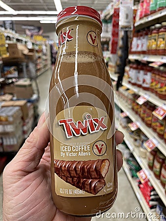 Grocery store hand holding Twix iced coffee Editorial Stock Photo