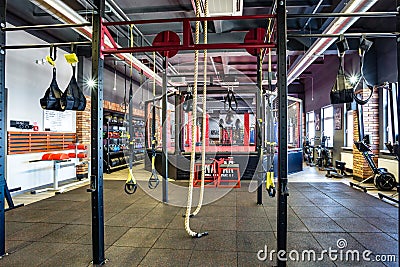 GRODNO, BELARUS - APRIL 2019: Hall of martial arts with fighting ring and punching bags in the modern Fight club Editorial Stock Photo